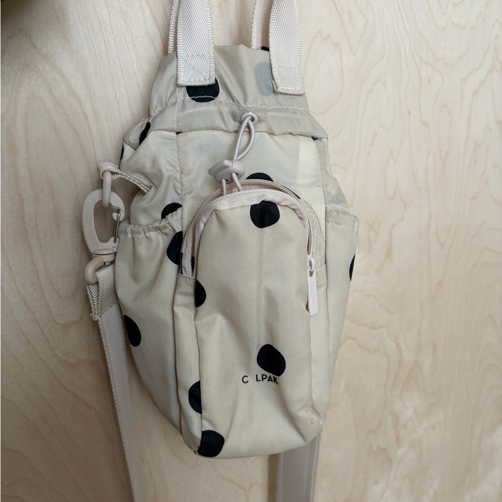 Calpak Cream and Black Polka Dot Backpack